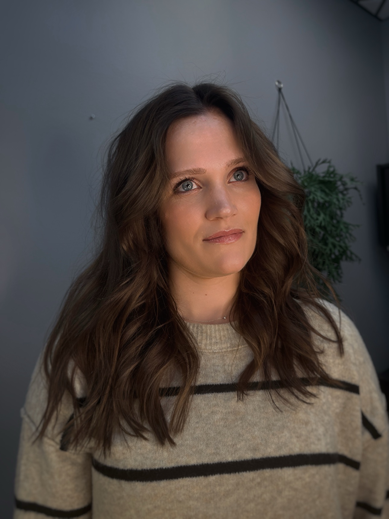 Rachel after her reverse balayage at CRIS HAIR in Malden: dimensional brunette depth with soft blonde ribbons